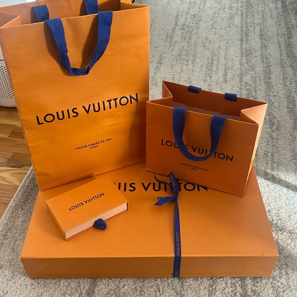 Assortment of Authentic Louis Vuitton boxes, bags and dust bags